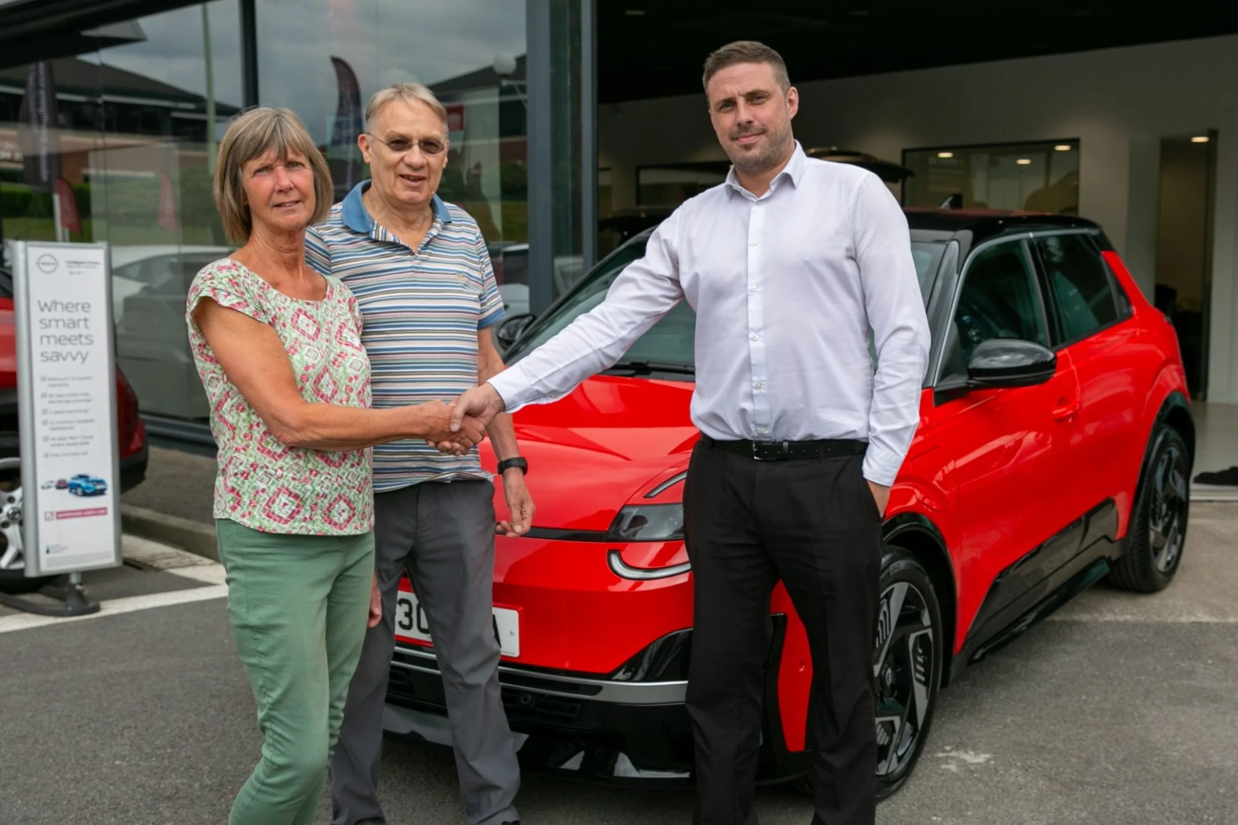 100k MICRA handshake.jpg