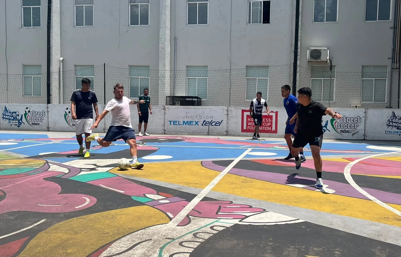 Male players playing football