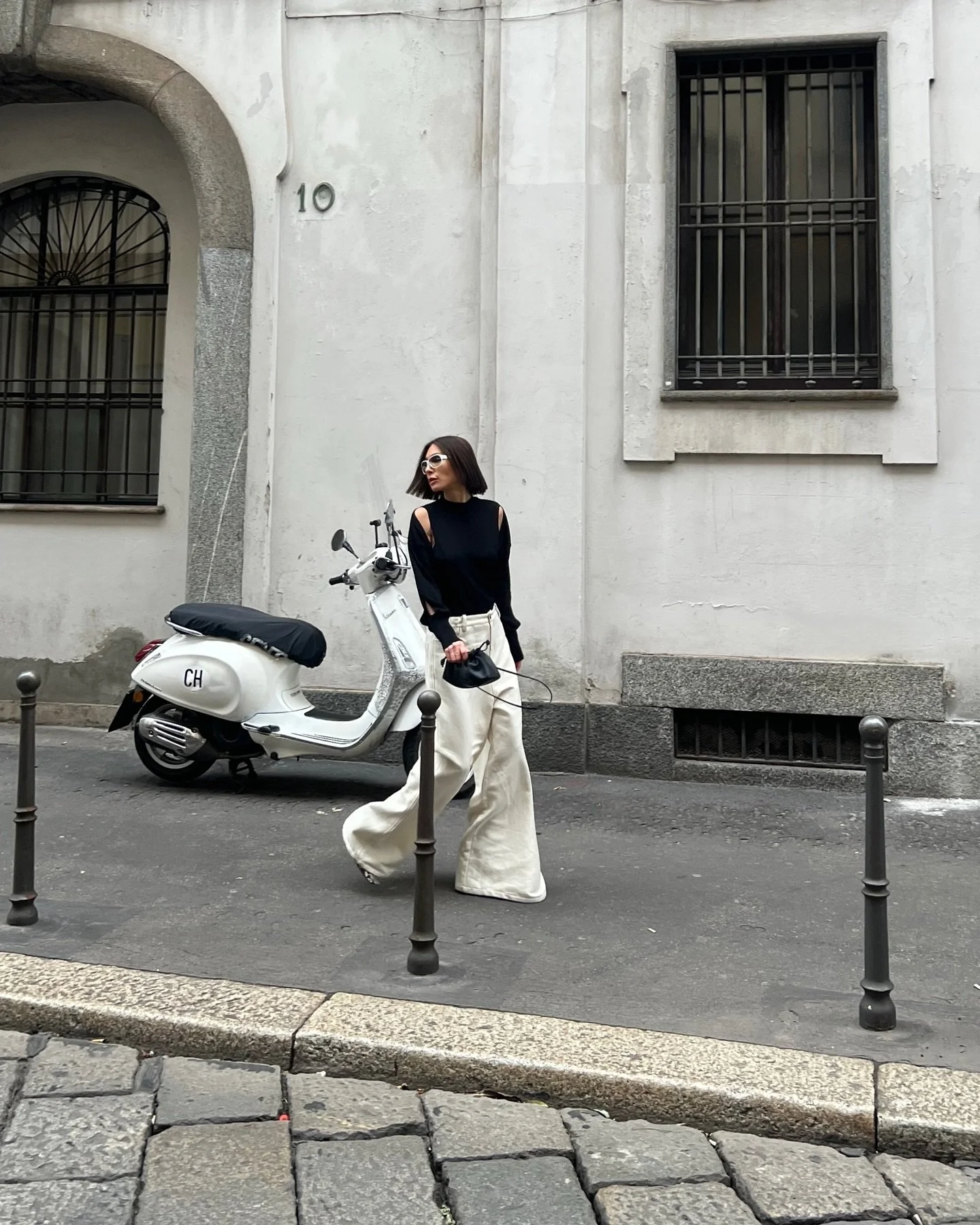 Black on white 

Wearing a merino cut-out top by @erikacavallini_official and wide leg wool trousers from @alysiofficial for extra volume. 
Represented by @around.studio.pr 

(Vintage Miumiu sunglasses, sourced by mom🤍)

.
.
.
.
.
#outfitideas #outf