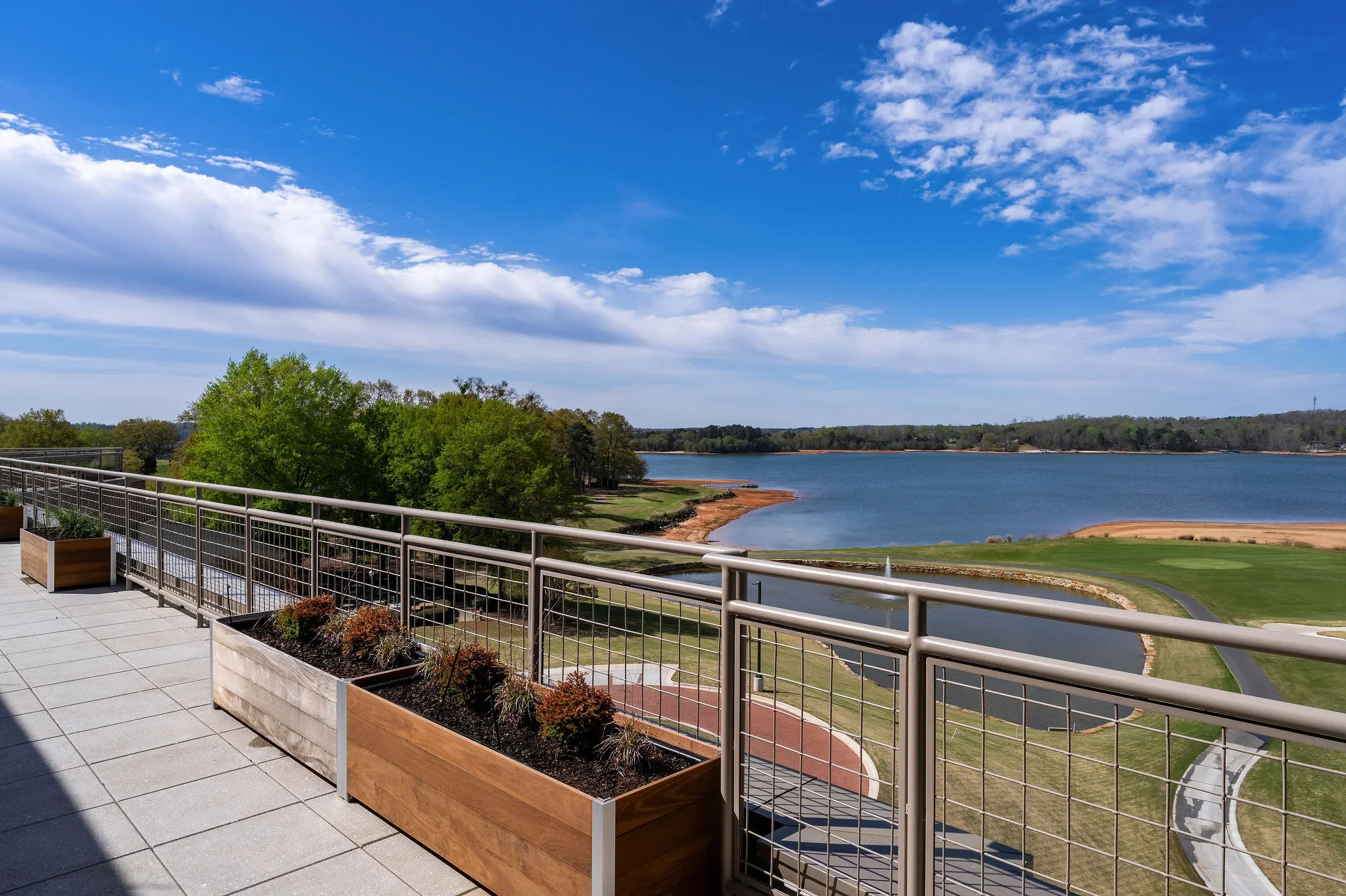Outdoor terrace at Clemson University’s Nieri Family Alumni and Visitors Center overlooking the lake, photographed for Harper General Contractors.