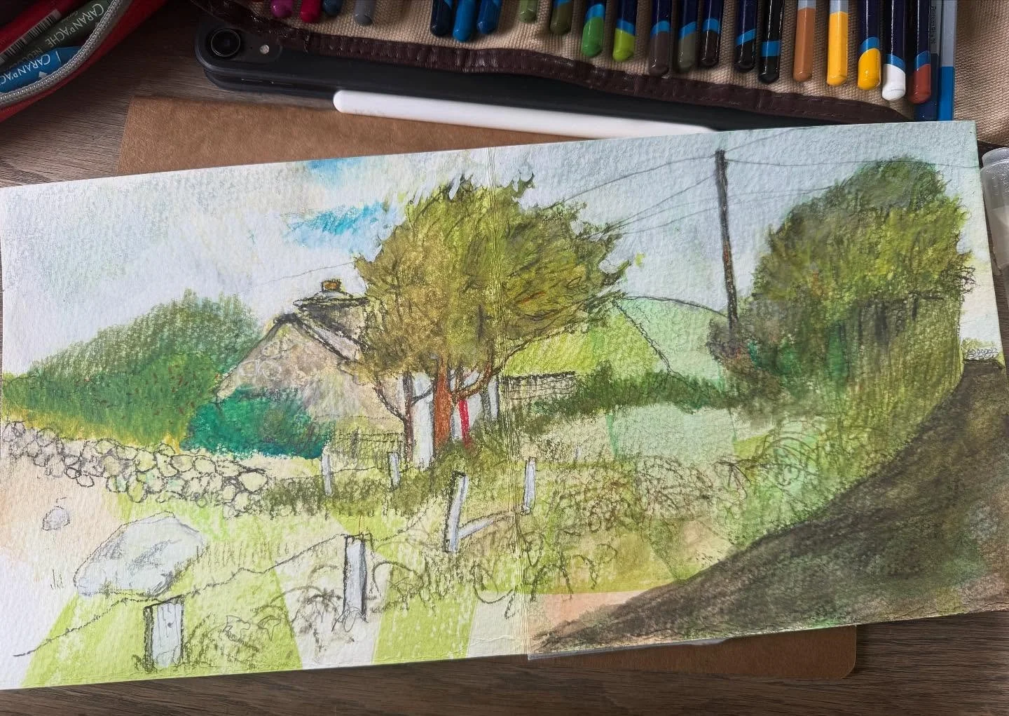 Sketching between showers! It&rsquo;s a on/off day in Connemara today - had to finish the sketch later indoors. Squally showers and sunny spells are all part of the pleasure here in #ballyconneely #connemara #westofireland #galway #sketch #cottage