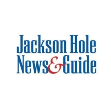 Logo of Jackson Hole News & Guide, featuring the publication's name in blue and red text.