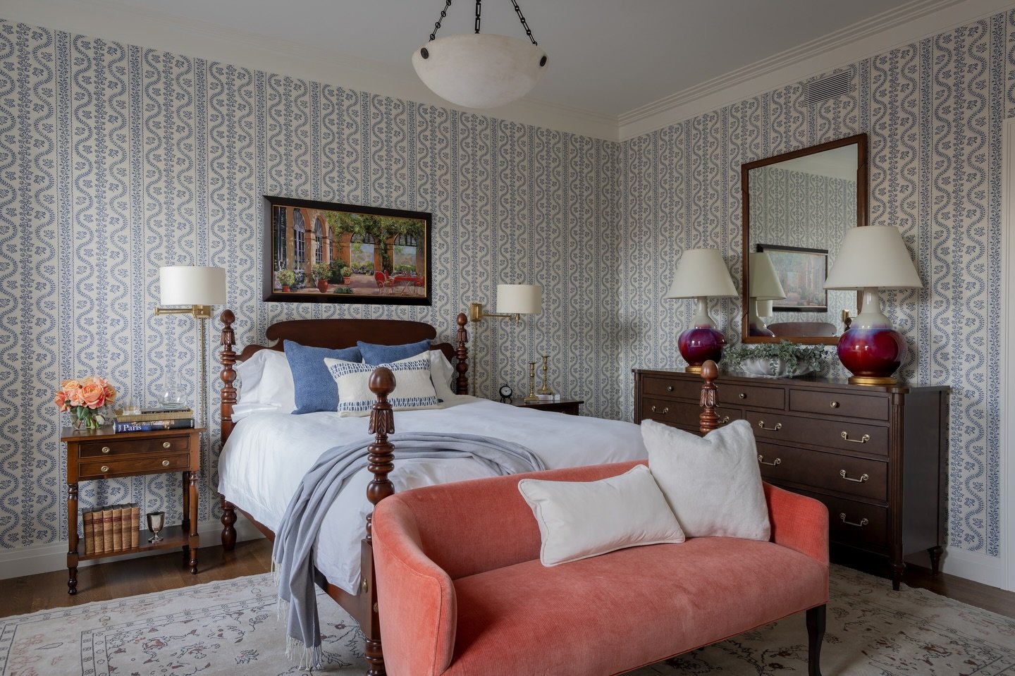 Traditional, yes. Predictable, never. ⁣
⁣
Classic blue, rich wood tones, and a coral velvet settee that refuses to be ignored.⁣
⁣
⁣
Interior design: @robingannoninteriors⁣
Builder: @brookesandhillcustom⁣
Photography: @michaeljleephotography