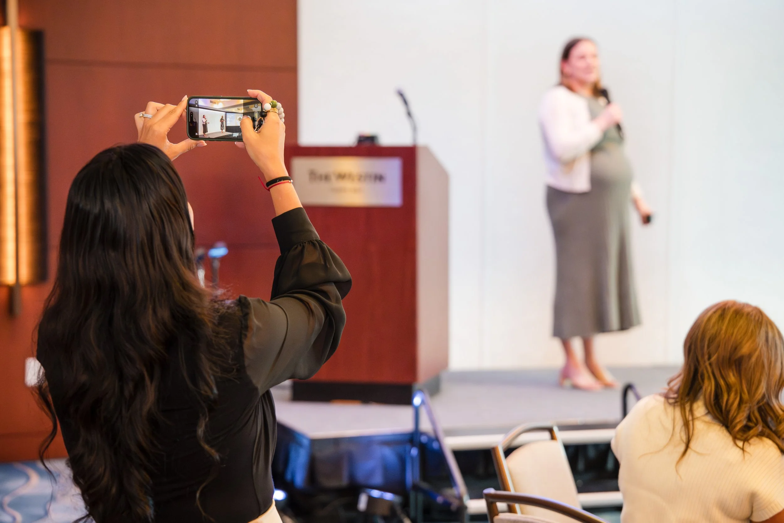 Female business speaker presenting during seminar session