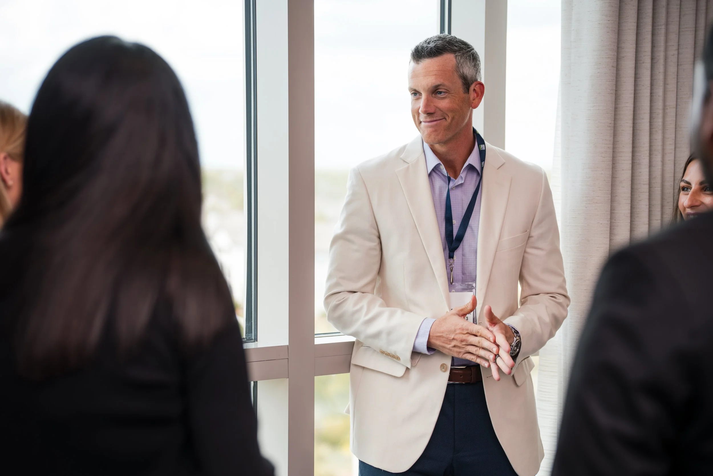 Business networking conversation during corporate event