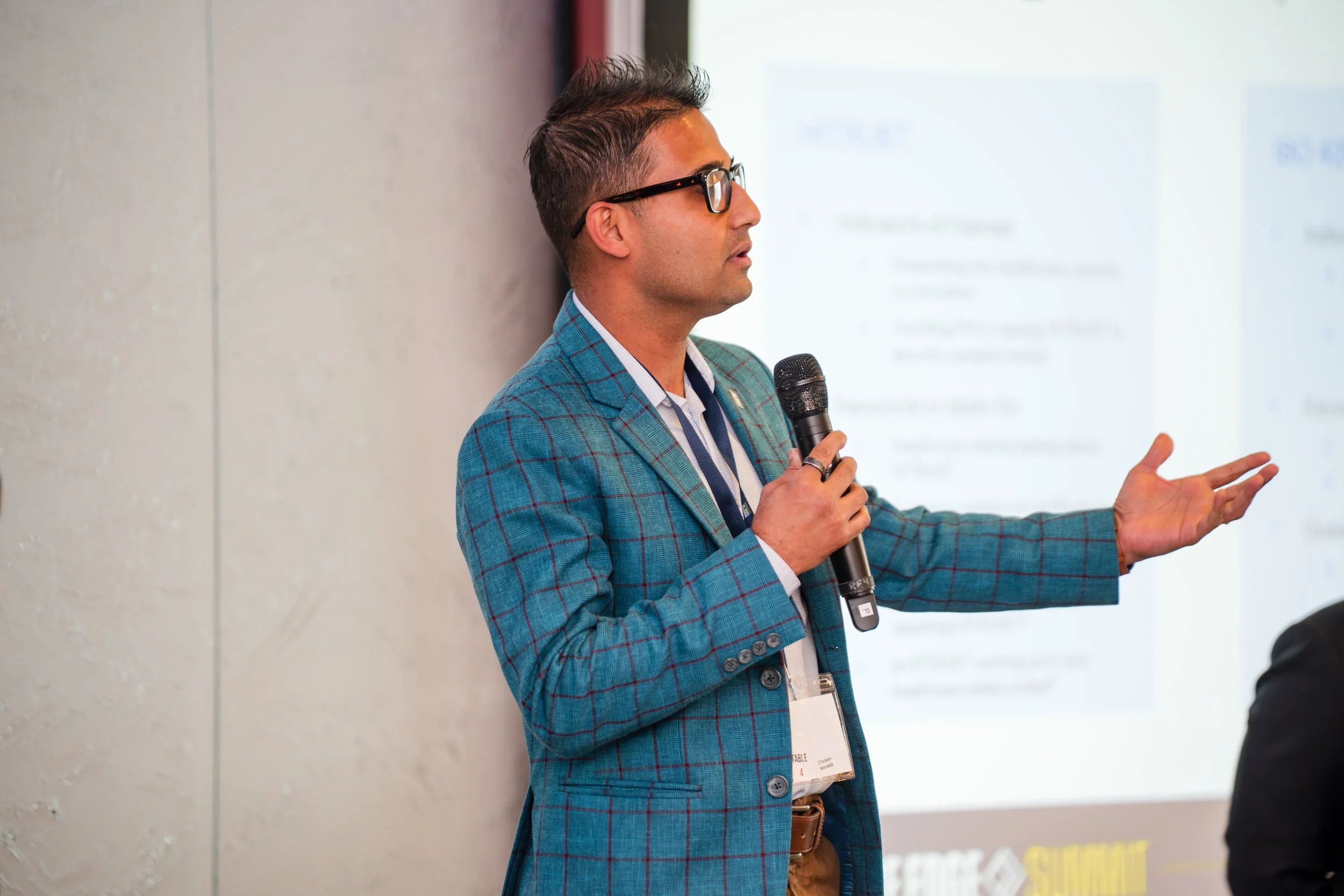 Business speaker presenting with microphone during seminar