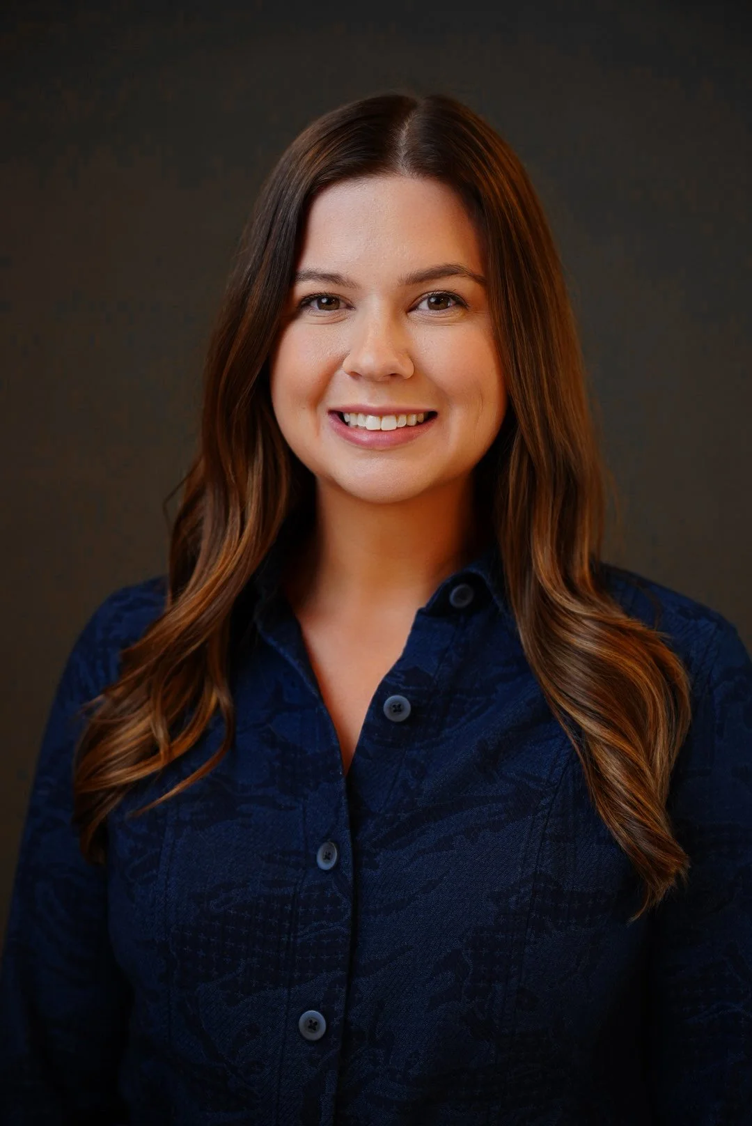 Professional corporate headshot of business executive