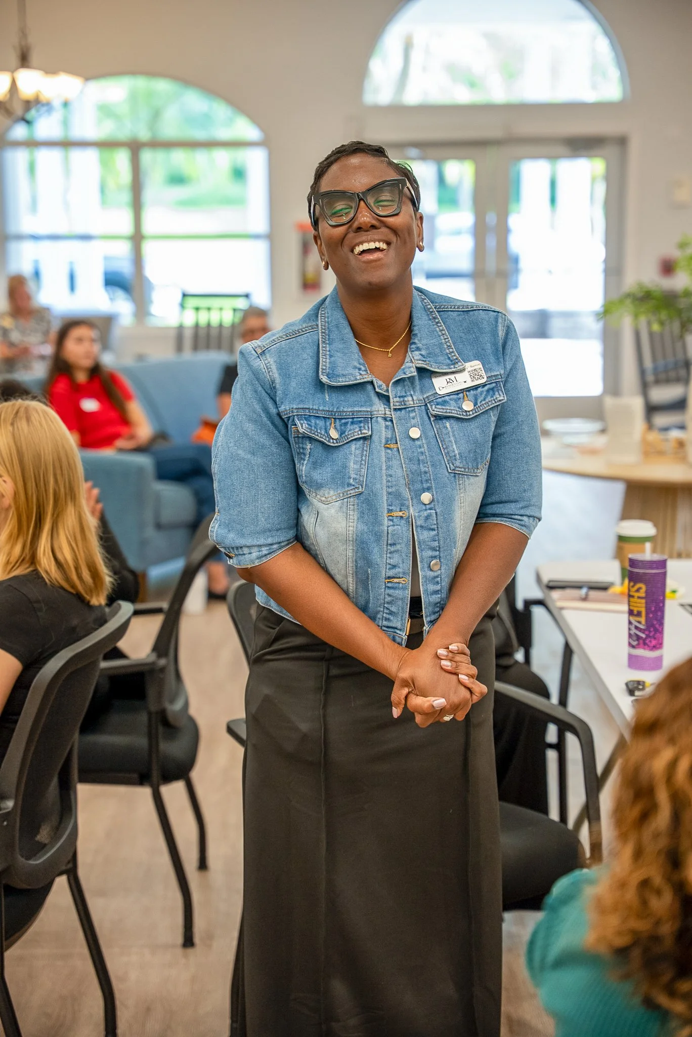 Workshop participant standing and speaking during training session