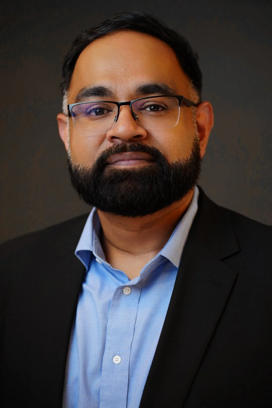 Corporate headshot portrait of leadership team member