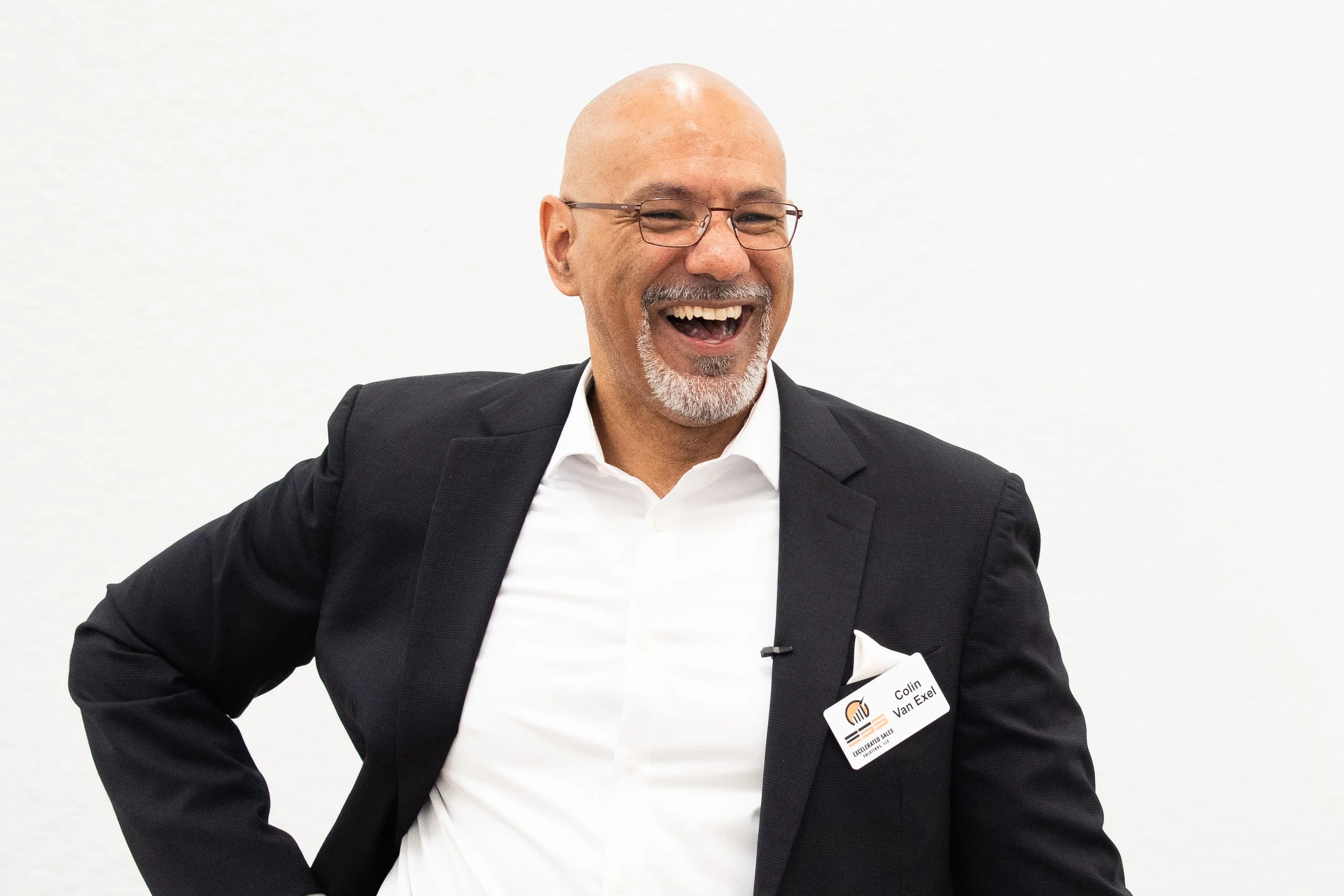 Executive portrait of business leader smiling during conference