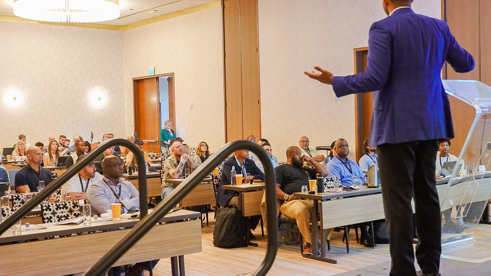 Business presentation with speaker at podium during conference