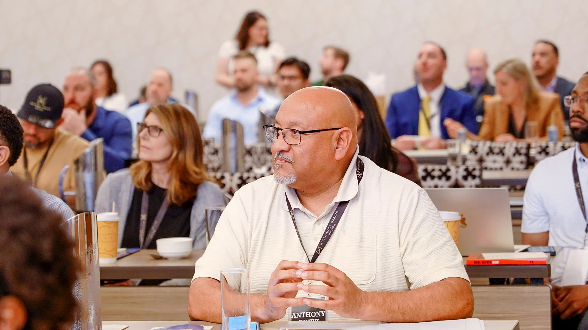 Audience members attending professional conference discussion