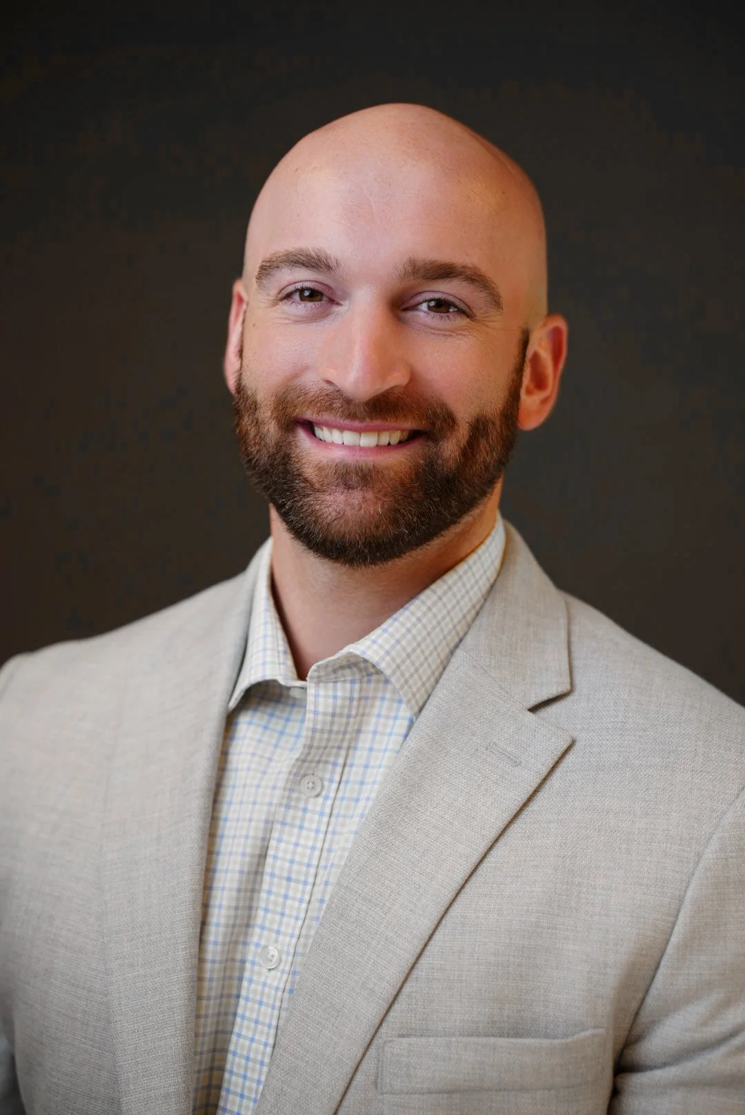 Corporate headshot portrait of leadership team member