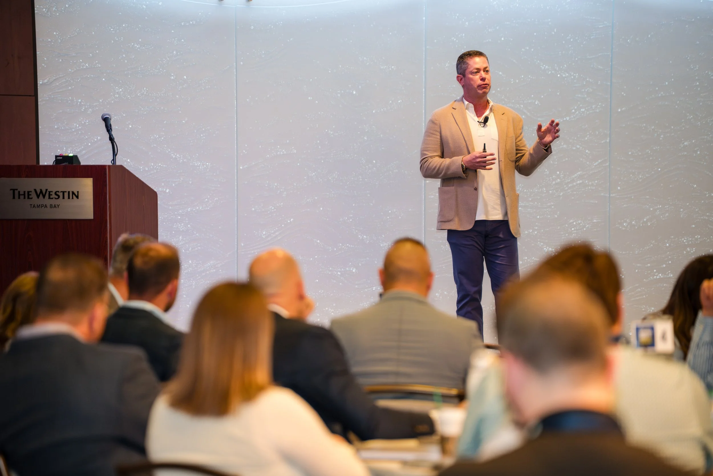 Corporate conference keynote speaker presenting to audience