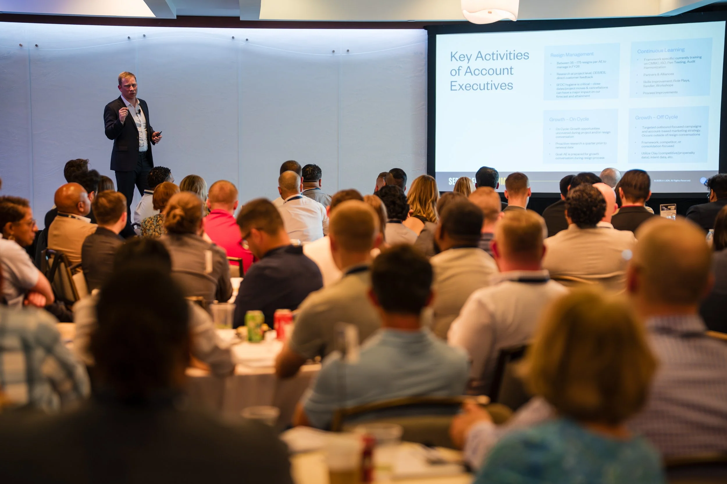 Business conference presentation with audience seated
