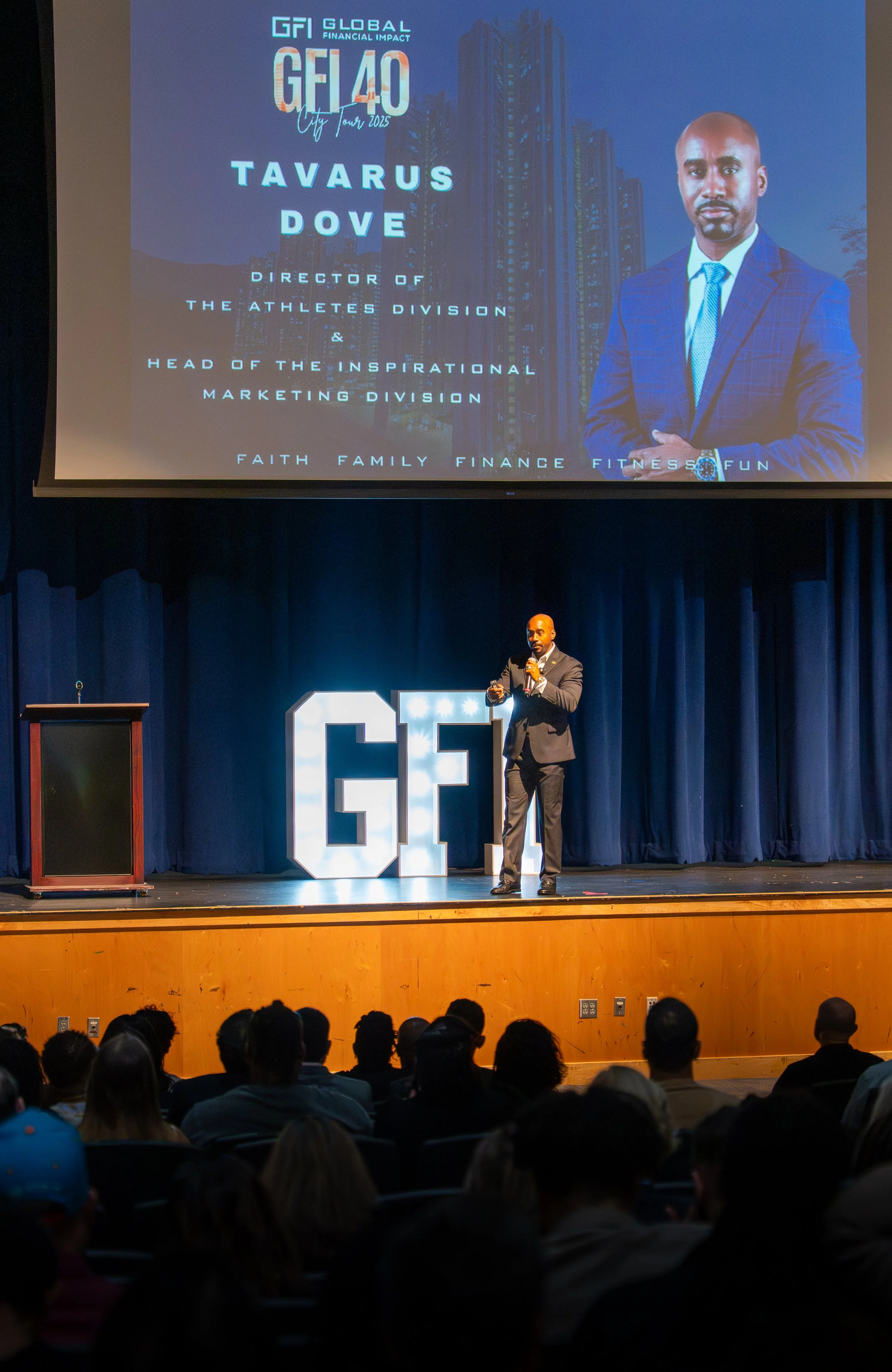 Corporate keynote speaker presenting on stage at conference