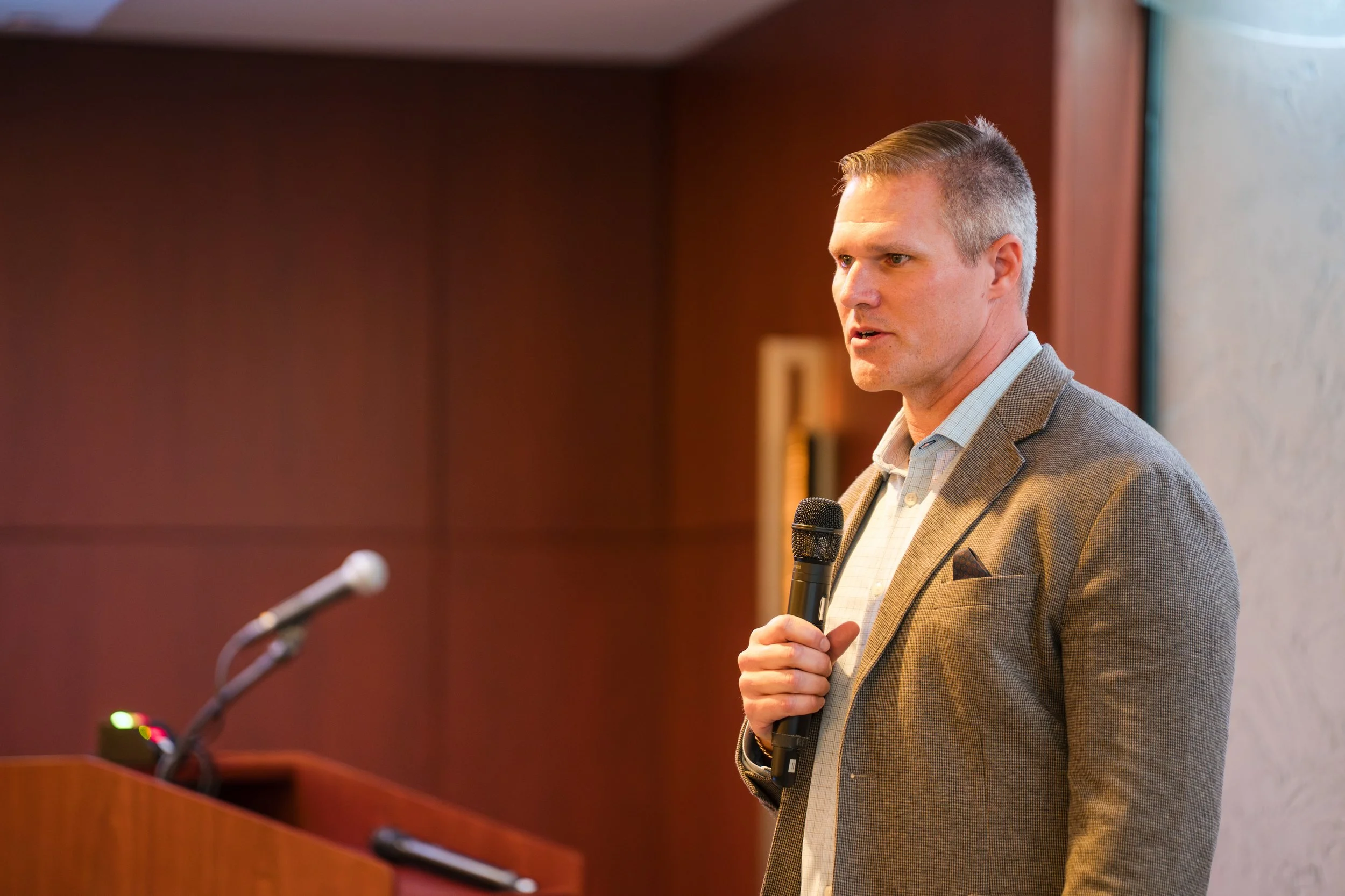 Corporate conference speaker presenting during keynote