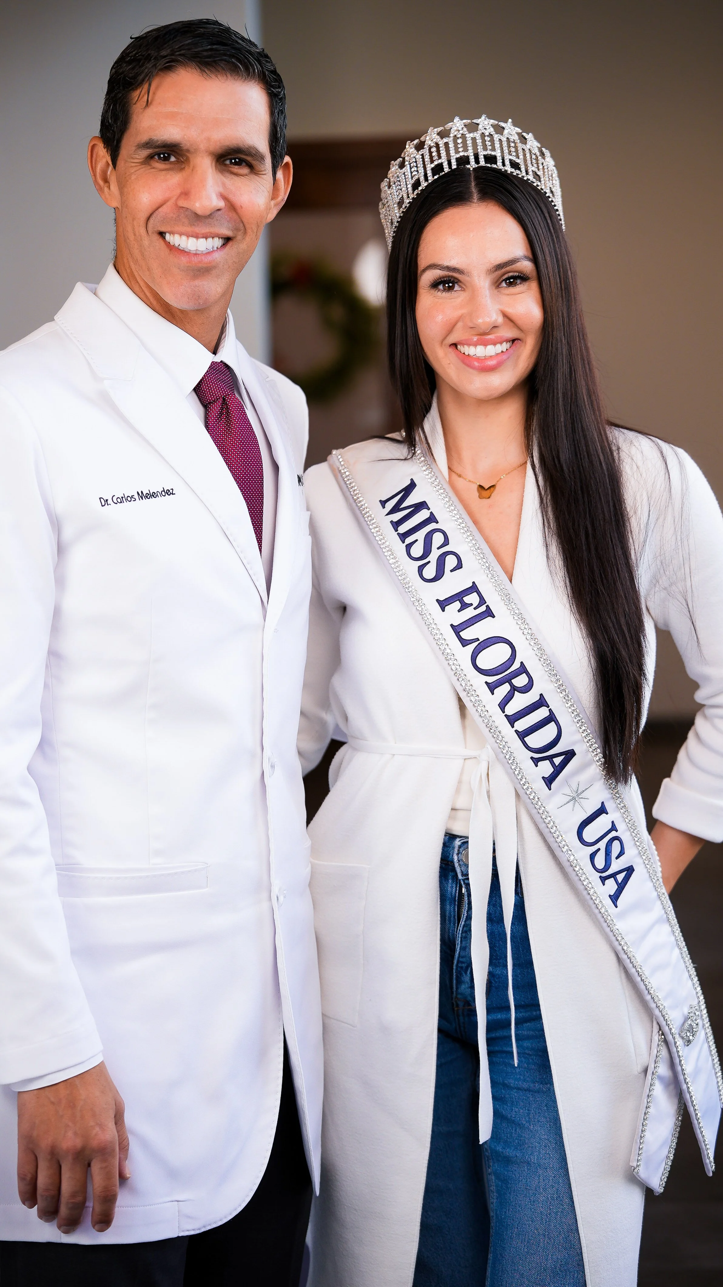 Medical professional posing with Miss Florida USA during healthcare event