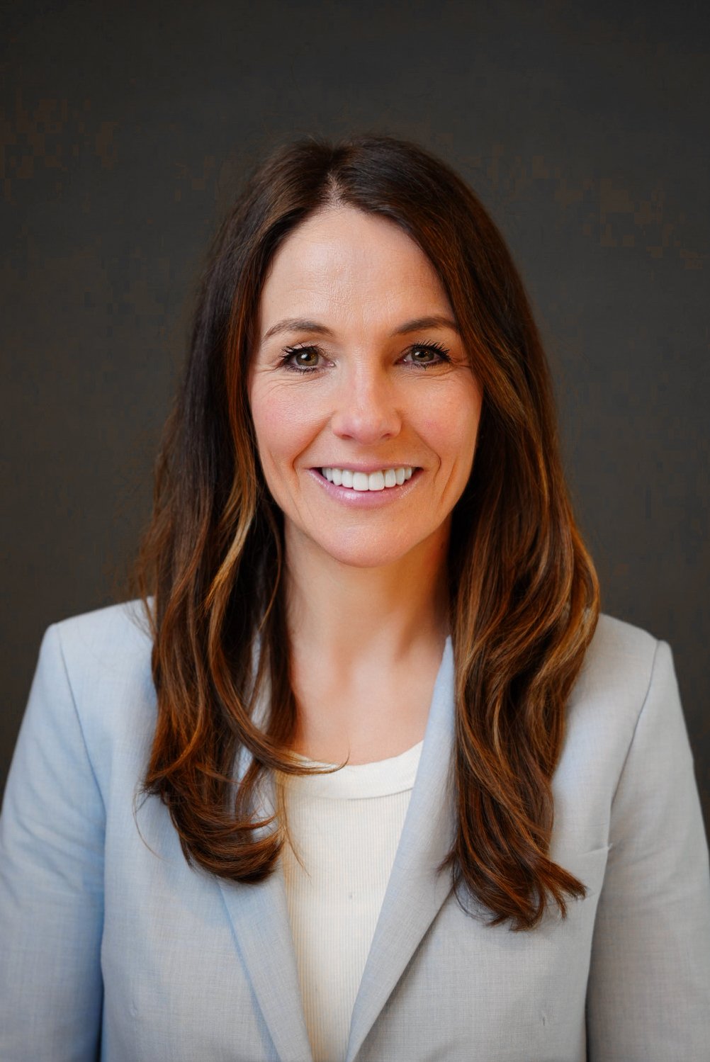 Professional corporate headshot of business executive