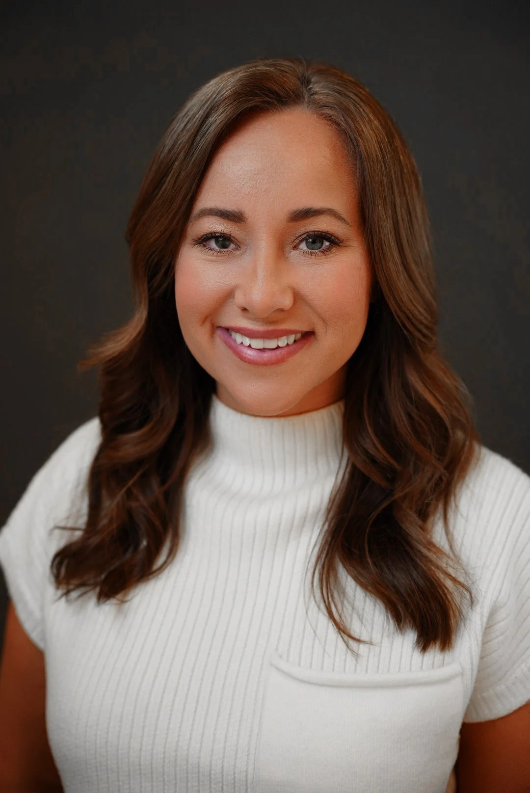 Professional corporate headshot of business executive