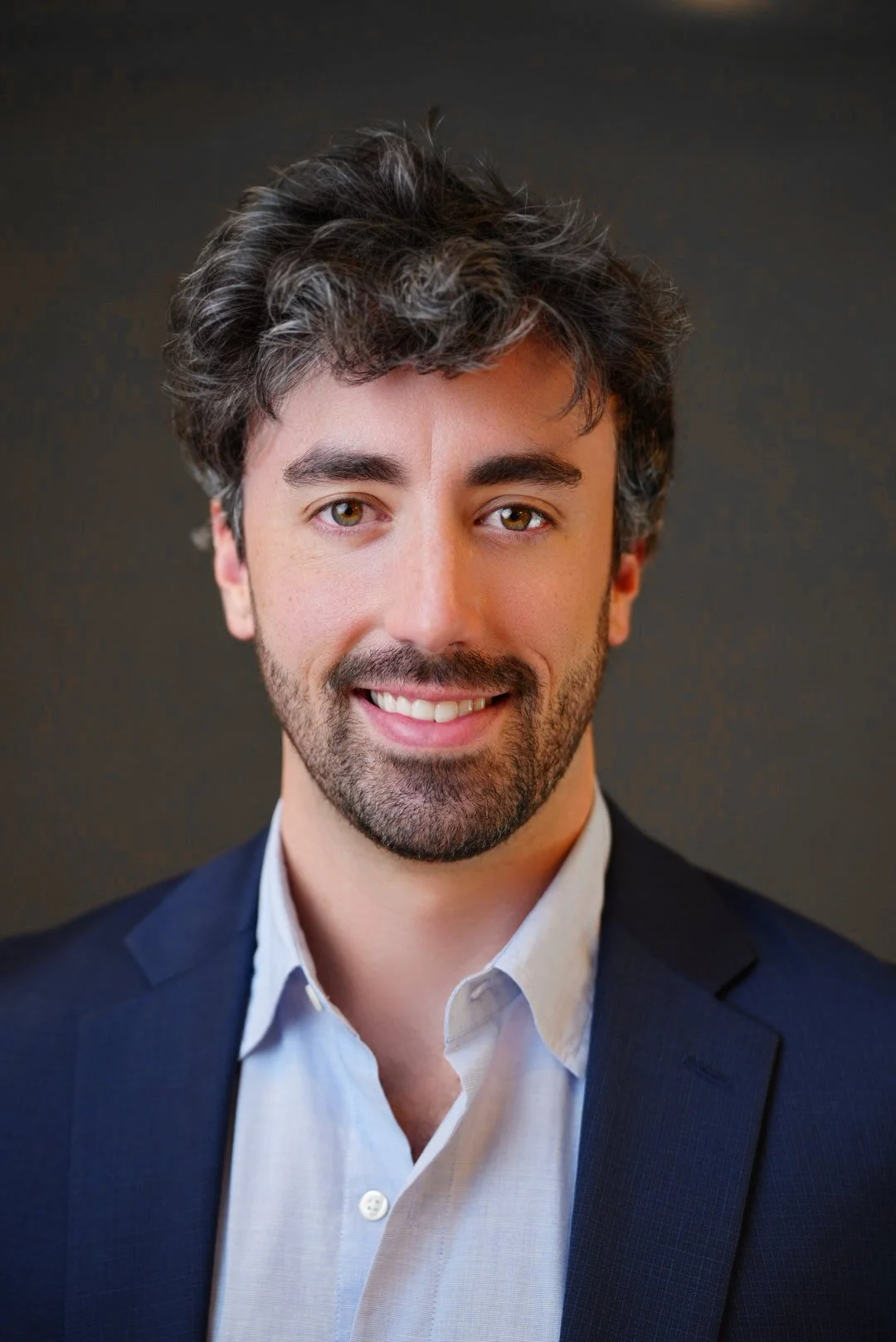 Professional corporate headshot of business executive