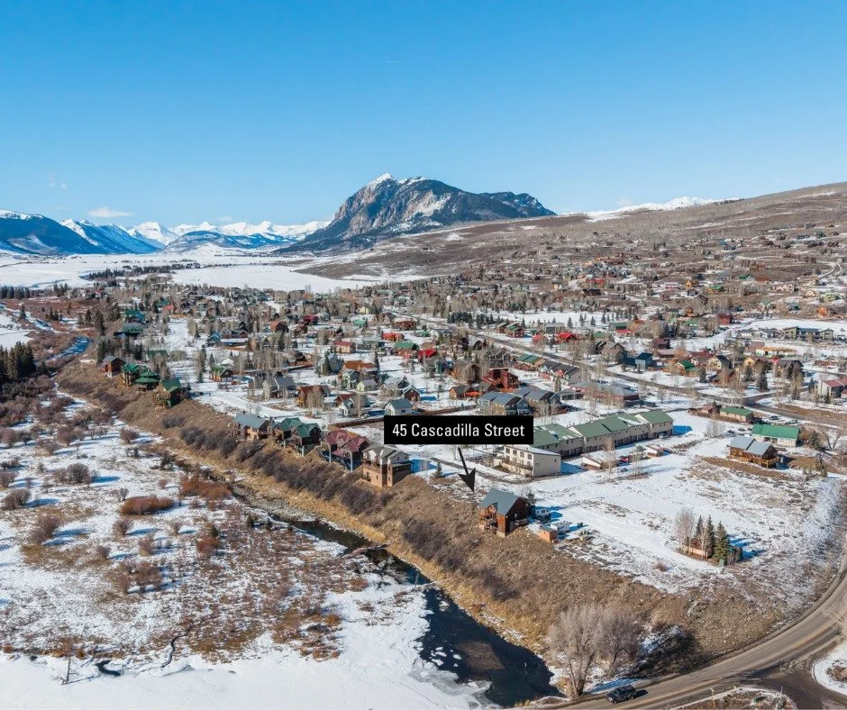 A rare opportunity to build on a vacant homesite overlooking the East River and surrounding wetlands, where mornings begin with wildlife and sweeping natural views. Welcome to 45 Cascadilla Street in Crested Butte South. This .41-acre lot sits above 