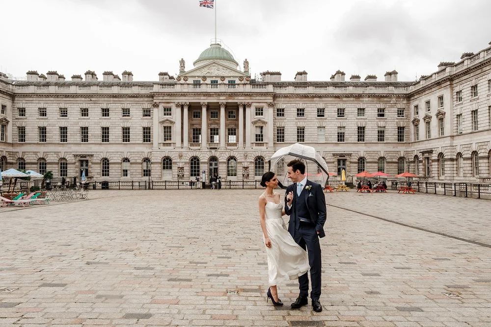 Bride and groom exiting the church together captured in classic black and white &mdash; timeless wedding photography