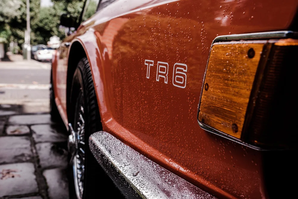 The orange Triumph TR7 that carried Katie to The Hurlingham Club