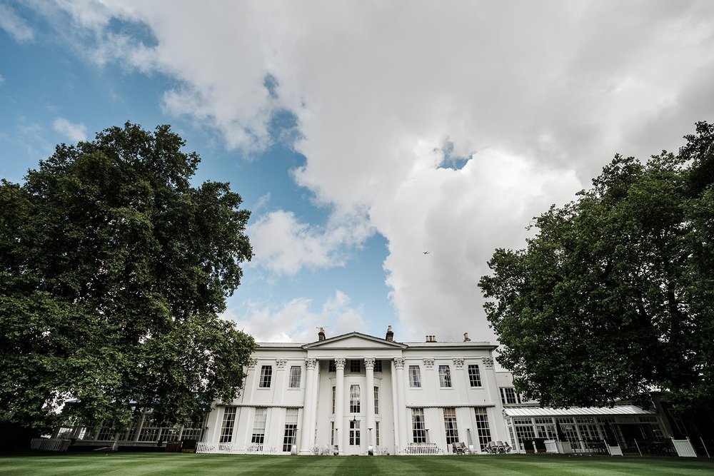 The Georgian frontage of The Hurlingham Club in Fulham on a clear summer morning