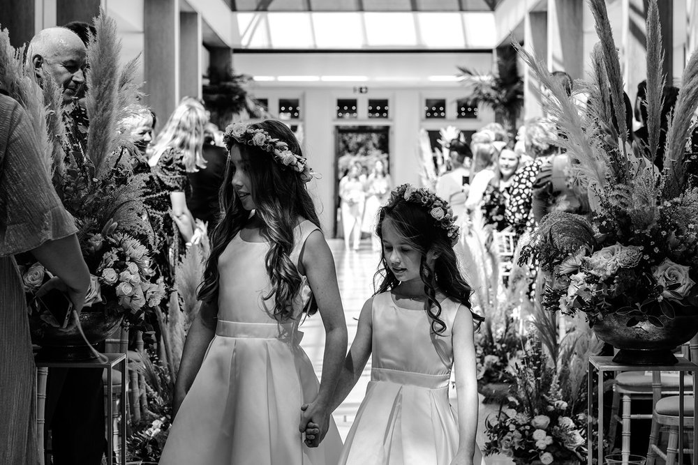 Black and white photograph of Katie with her bridesmaids before the ceremony