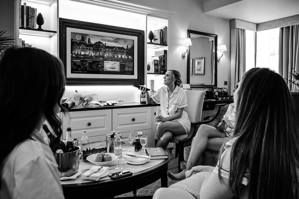 Black and white photograph of the bridal party getting ready at Grantley Hall