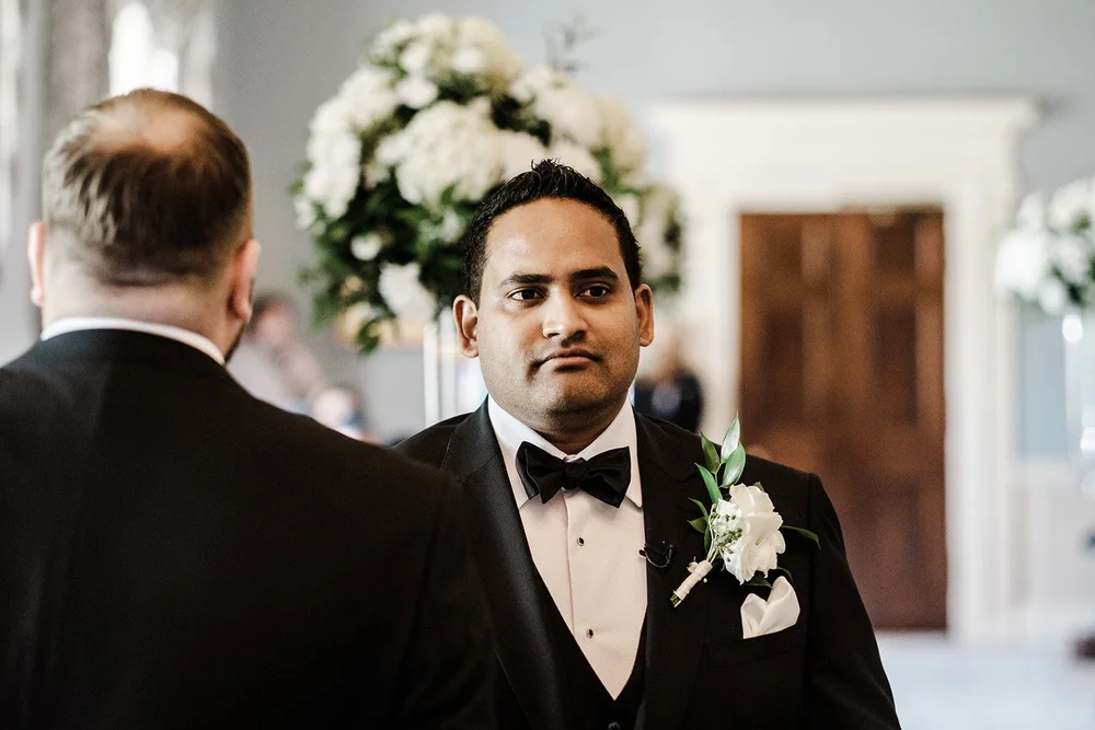 Naesan having his bow tie straightened before the ceremony
