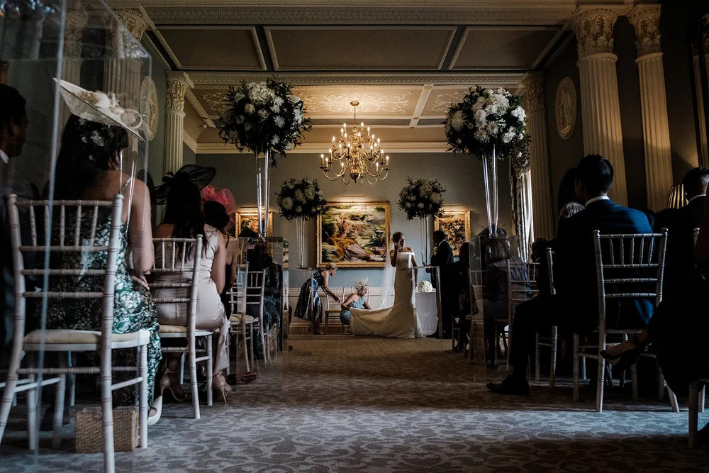 Bernie walking through the panelled corridor at Grantley Hall