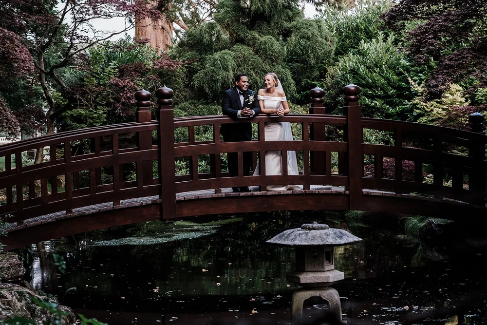 Bernie and Naesan on the red bridge in the Japanese garden at Grantley Hall