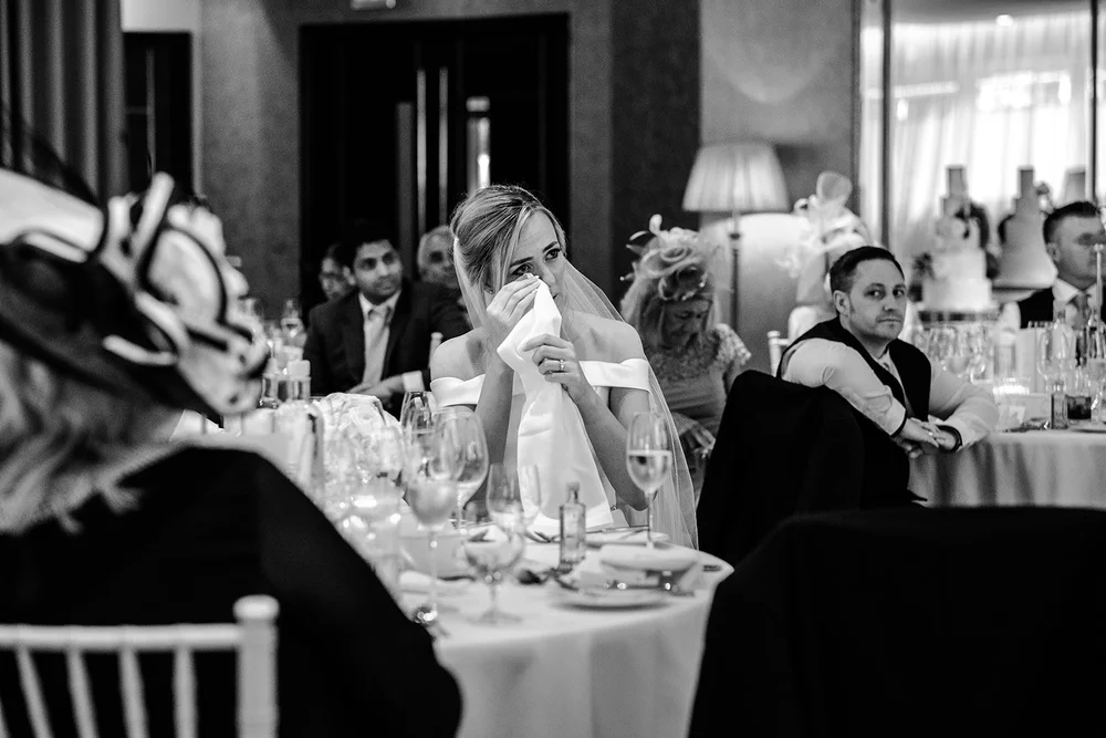 A guest listening to the speeches at Grantley Hall