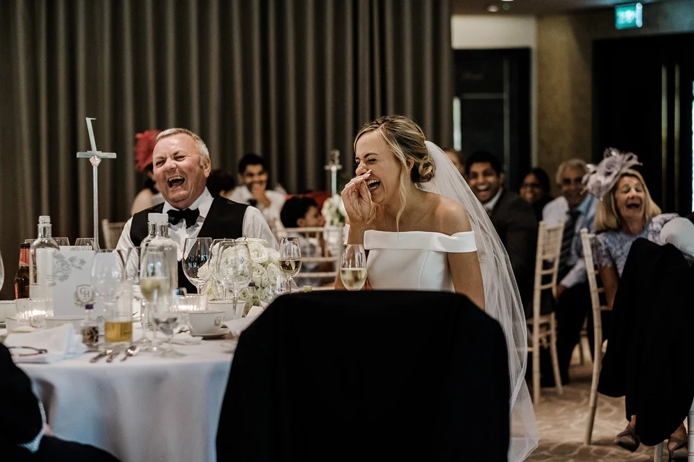 Guests around the table during the wedding breakfast at Grantley Hall