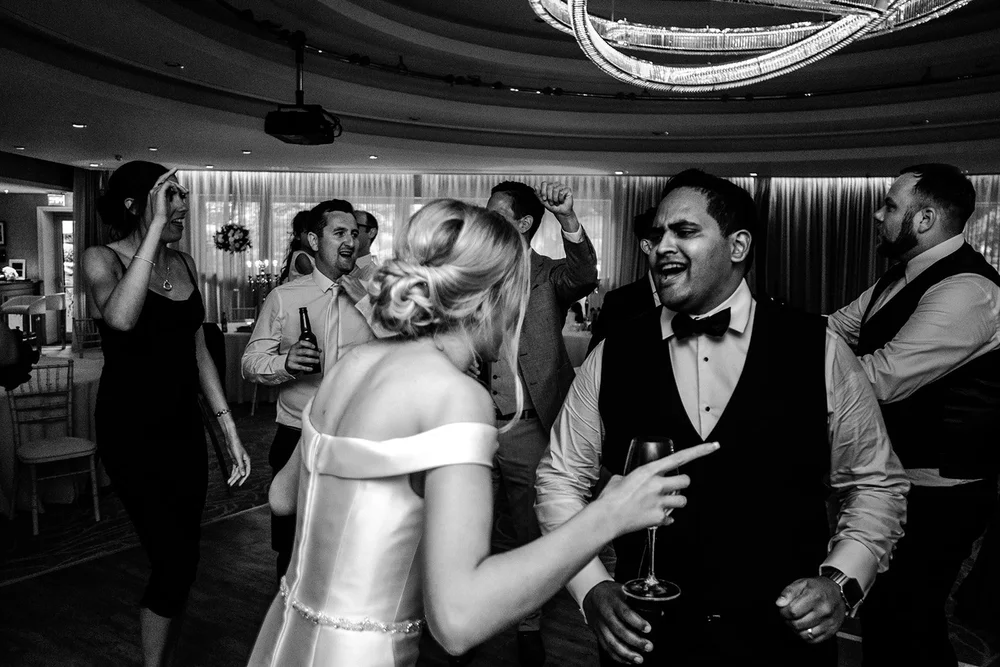 Black and white photograph of Naesan dancing with a guest