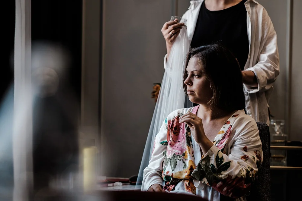 Anna having her make-up done on the morning of her Barbican Conservatory wedding