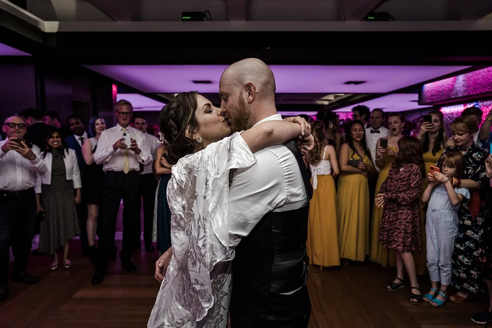 Jordan and Anna&rsquo;s first dance under the purple lights at the Barbican