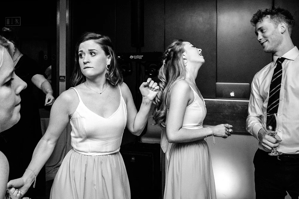Black and white photograph of guests on the dance floor