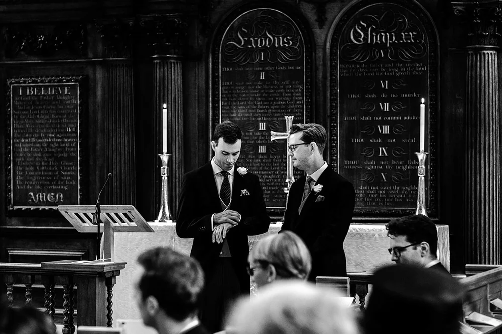 Ollie and his best man waiting in the chancel before the ceremony at Temple Church