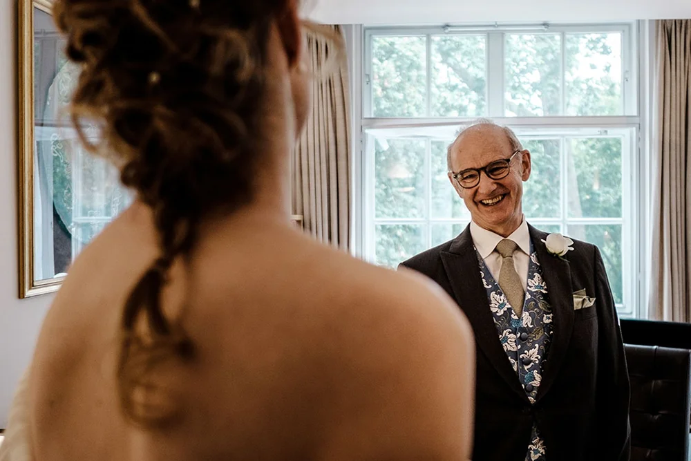 Gina and her father in the window light before the ceremony at Temple Church