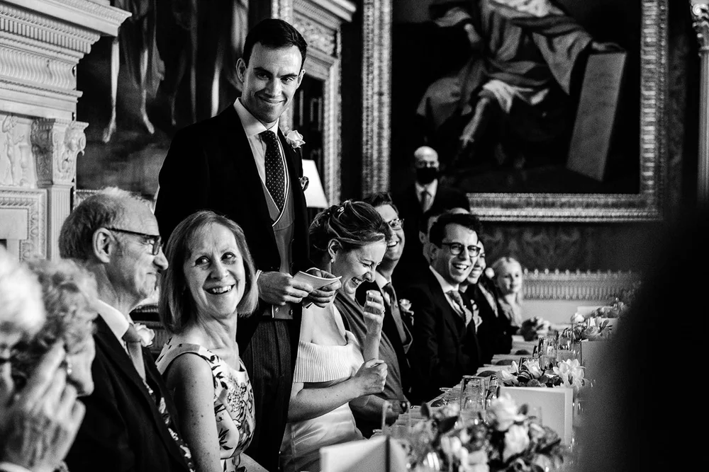 Guests laughing at the table during dinner at Spencer House