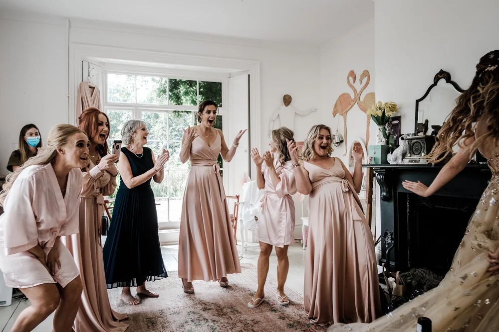 Jess and her bridesmaids celebrating before the ceremony at Lyde Court
