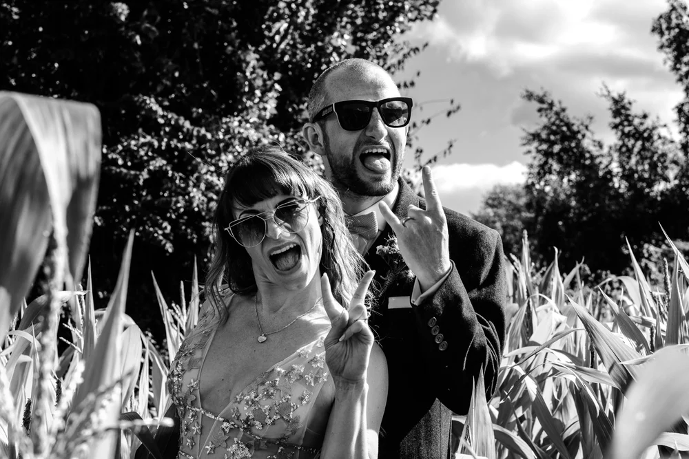 Black and white photograph of a musician performing at Jess and Tom&rsquo;s wedding