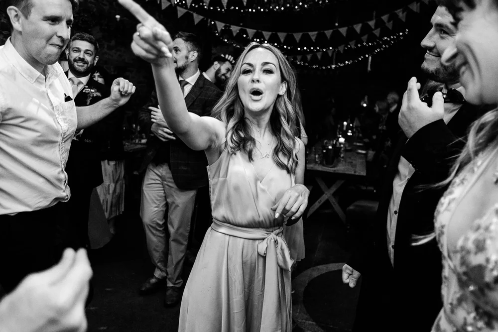 Black and white photograph of guests dancing late into the night at Lyde Court