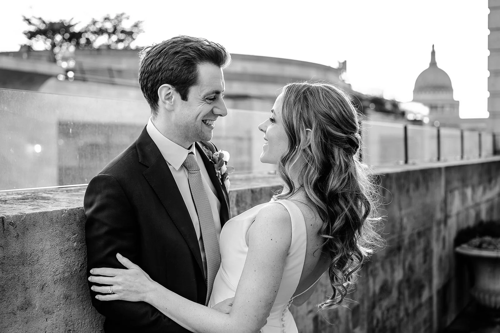 Jess and Tom on the terrace at The Ned with St Paul&rsquo;s Cathedral behind them