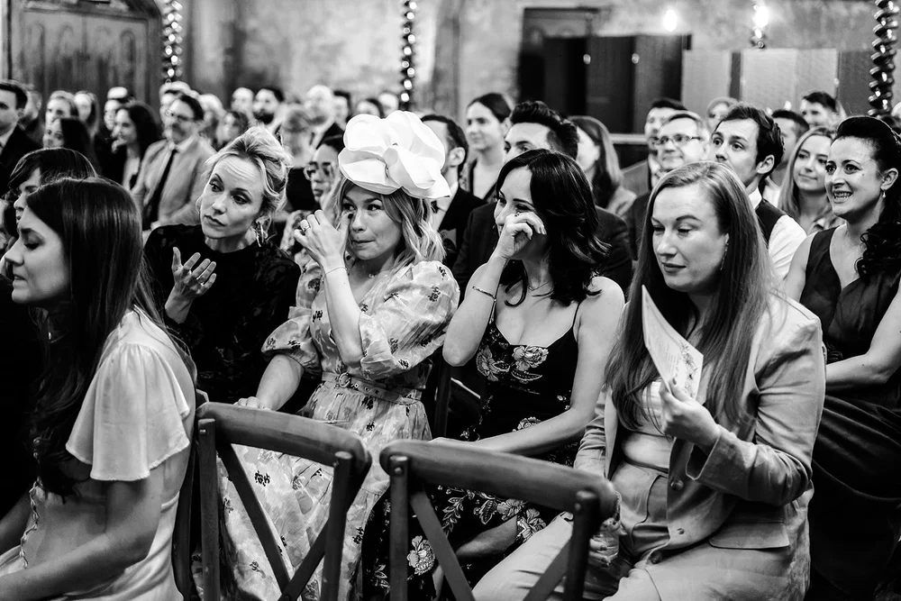 Black and white photograph of guests watching the ceremony from the gallery at Wilton&rsquo;s Music Hall