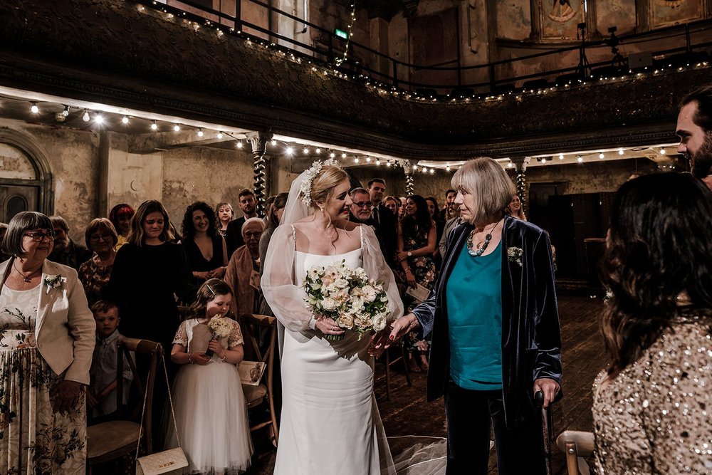 Meg greeting guests as she arrives at Wilton&rsquo;s Music Hall in East London