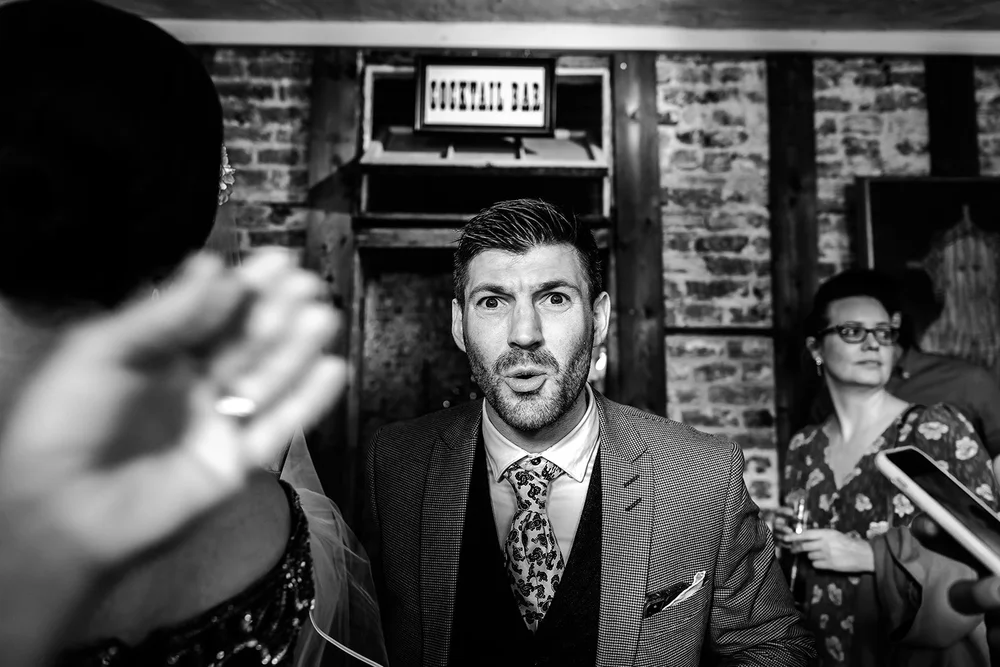 Black and white photograph of Jamie during the wedding ceremony